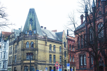 Fototapeta premium Post card view amber house in Germany Hamburg, european street and roofs closeup