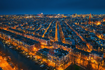 Amsterdam night city skyline aerial view from above, Amsterdam, Netherlands. © DedMityay