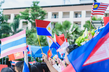 Celebrate ASEAN Day falls on Aug. 8,Students hand holding carry the flag of of the Association of Southeast Asian Nations,Celebrating 47 years of ASEAN