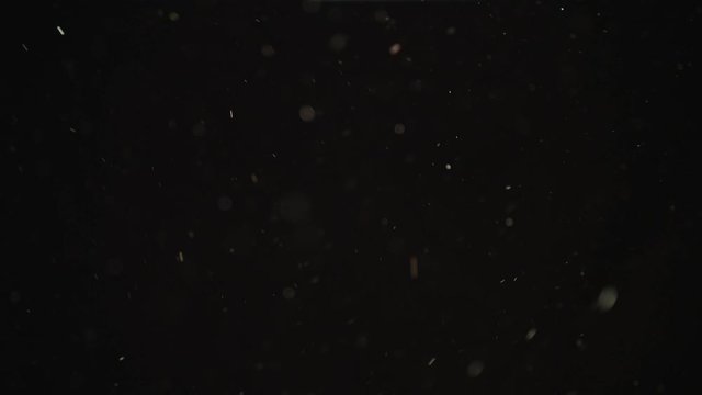 4k Natural Dust Organic Floating particles on black background. Dust in air atmosphere for your projects! Just drop it over your footage and use blending (screen) mode