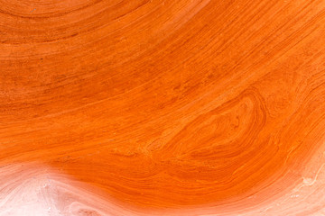 Bright orange colorful sandstone abstract closeup of rock formations at Antelope slot canyon in Arizona on trail from Lake Powell with lines and shapes