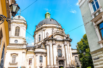 Fototapeta na wymiar Lviv, Ukraine Dominican church cathedral exterior with dome in historic Ukrainian Polish Lvov city during day