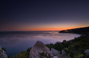 The nature on Crimea. Night in coast. Sunset on the Black sea.