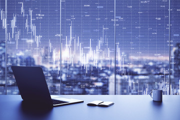 Laptop on table in office interior with stock market crash chart