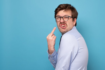 Fuck sign. Anger man showing fuck at camera.