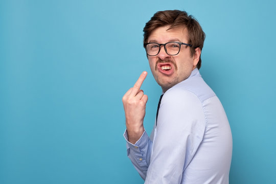 Fuck sign. Anger man showing fuck at camera.