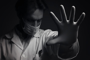 Virus mask male doctor wearing face protection in prevention for coronavirus showing gesture Stop...