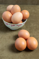 image of fresh brown eggs on fabric background also brown