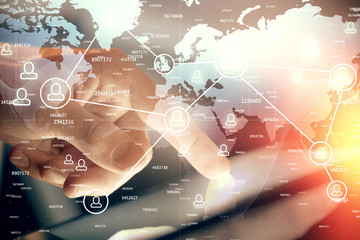 Double exposure of man's hands holding and using a phone and social network theme drawing.