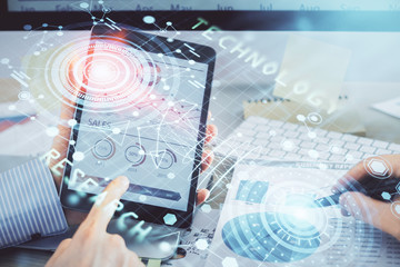Multi exposure of man's hands holding and using a digital device and data theme drawing. Innovation concept.