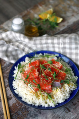 Selective focus. Macro. Poke bowl with salmon and microgreens. Healthly food.