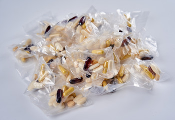 Bags of pills on white background