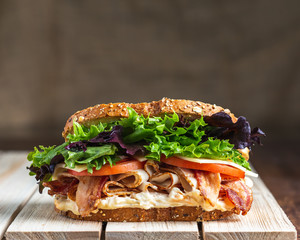 BLT sandwich on wooden surface