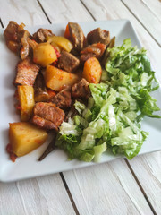 Gyuvech-traditional Balkan food with meat, potatoes and vegetables