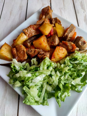 Gyuvech-traditional Balkan food with meat, potatoes and vegetables