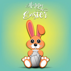 Rabbit with easter egg decorated in the form of a volleyball ball