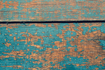 Fototapeta na wymiar Wooden texture with cracked paint. shabby wood background