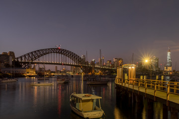 Naklejka premium dawn cityscape with harbour and pier