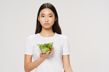 young woman holding salad