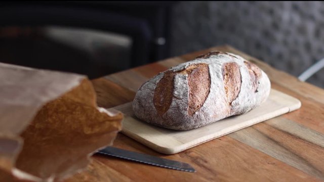 Fresh Bread On A Cutting Board In A Rustic Home