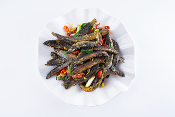 A plate of Hunan home-cooked spicy loach on a white background