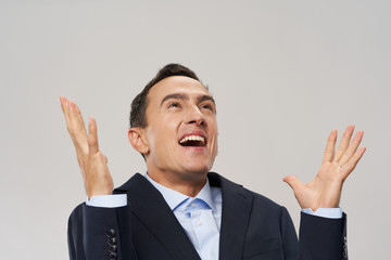 young businessman with hands up