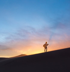 Photographer exploring Great Sand Dunes, Colorado