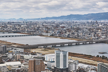 Fototapeta premium Wide Osaka City View with River and Bridges, Daytime Panorama