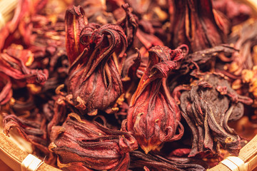 close-up of dried roselle flower in wooden bowl  for made herbs tea or rosella Juice