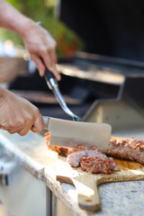 Cutting meat on a cutting board