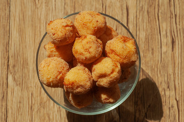 art background photo of a plate with Russian donuts on a wooden background