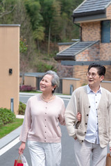 Naklejka premium A shopping Asian elderly couple