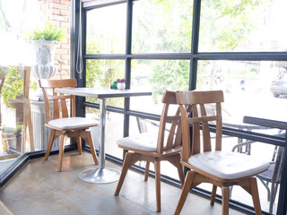 CafLong exposure brick cafe and bar  row of chairs near glass windows
