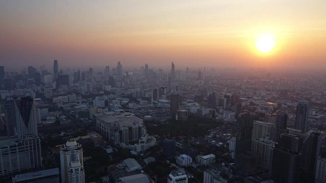 Aerial landscape with beautiful sunset in Bangkok, Thailand, zoom in timelapse 4k