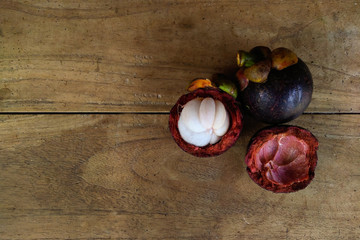 Garcinia mangostana or mangosteen on the wooden table.