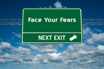 Face Your Fears sign for courage concept.