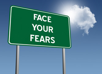Face Your Fears sign for courage and bravery concept.