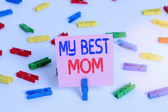 Writing note showing My Best Mom. Business concept for Appreciation for your mother s is love feelings compliment Colored clothespin papers empty reminder white floor background office