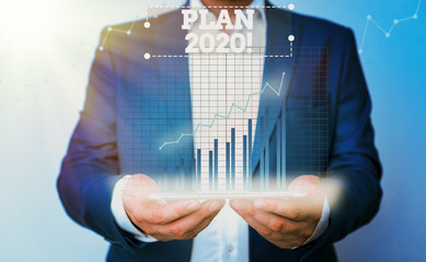 Conceptual hand writing showing Plan 2020. Concept meaning detailed proposal doing achieving...