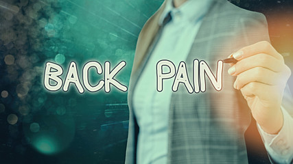 Writing note showing Back Pain. Business concept for Soreness of the bones felt at the lower back...