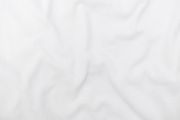 Abstract white fabric texture background. Wavy white cloth.