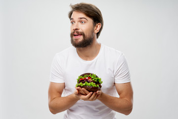 young man holding an apple in his hands