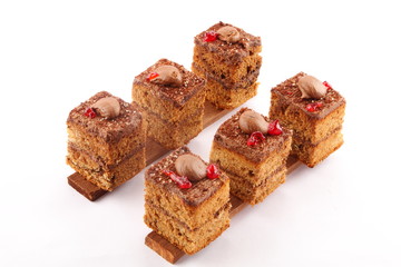 Top view- chocolate cream cake slices - brunch background