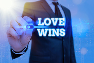 Writing note showing Love Wins. Business concept for used to celebrate or commemorate the victory...