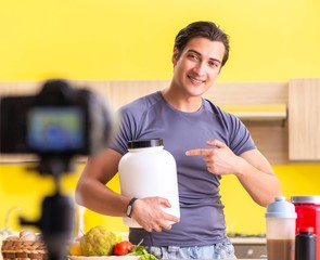 Young man blogging about food supplements