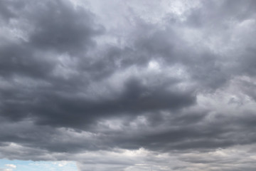 Obraz premium Dark storm clouds before rain used for climate background. Clouds become dark gray before raining.