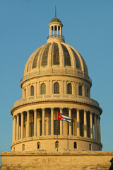 Morning light on the Capitolio and Cuban Flag, the Cuban capitol building and dome in Havana, Cuba