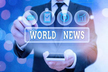 Handwriting text World News. Conceptual photo global noteworthy information about recent or...