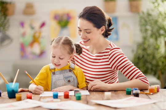 Happy family painting together.