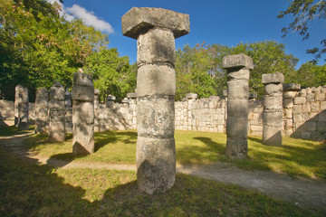 Fototapeta na wymiar Columns surrounding grassy courtyard for ballgames at Chichen Itza, Mayan Ruins in the Yucatan Peninsula, Mexico